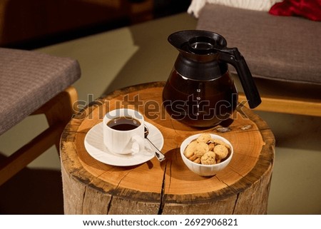 A Cozy Coffee Setup Featuring Delicious Cookies on a Beautiful Wooden Table Display