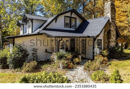 Cozy cottage in autumn scene. Cottage house. Cozy cottage. Cottage in autumn