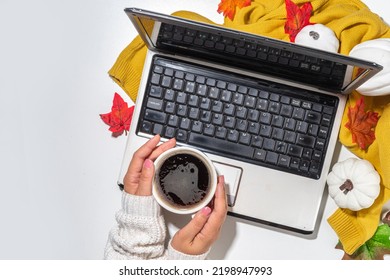 Cozy Fall Background With Coffee Cup, Tablet Notebook, Ear-pods, White, Orange Pumpkins, Autumn Leaves Decor On White Home Office Table Background. Autumn Still Life Composition Flatlay