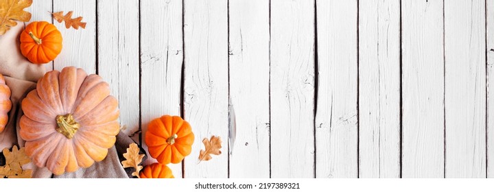 Cozy Fall Corner Border With Pumpkins, Leaves And Blanket. Overhead View On A White Wood Banner Background.