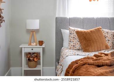 Cozy fall decor in a light and bright bedroom - Powered by Shutterstock