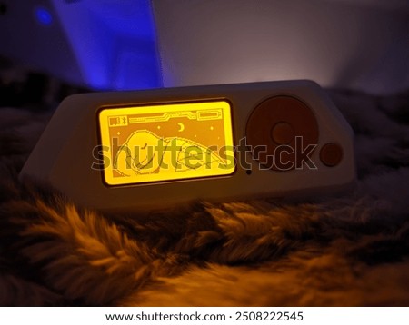 A cozy Flipper Zero sleeping on a soft, fluffy bed illumated with a soothing orange glow