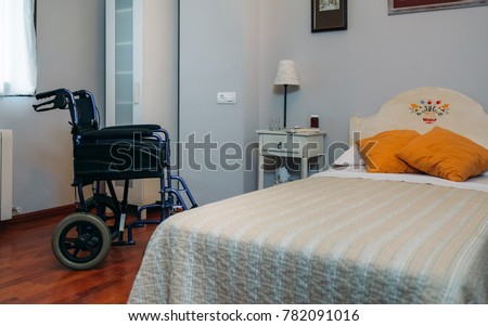 Similar – Caregiver with elderly patient in a wheelchair in front of window