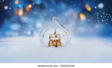  Cozy gingerbread house in christmas bauble over snowy background with copy space  - Powered by Shutterstock