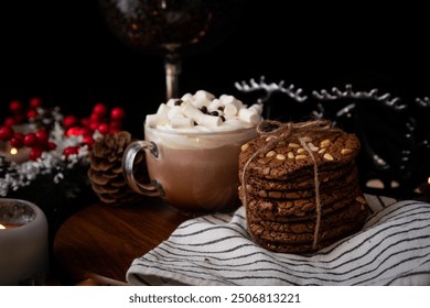 Cozy holiday setting with hot chocolate topped with marshmallows and stacked chocolate chip cookies, festive decorations in the background. - Powered by Shutterstock