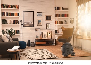 Cozy Home Library Interior With Comfortable Furniture And Collection Of Different Books On Shelves