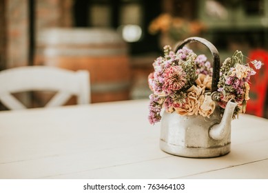 Cozy Home Rustic Decor. Flowers On Teapot.