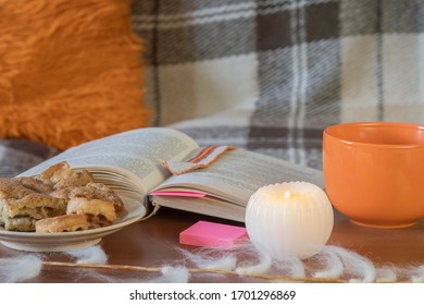 A Cozy Home Still Life From A 19th-century Book By Jane Austen, Coffee, Candles And Cookies On A Plaid Background.