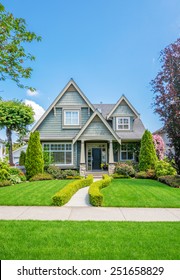 Cozy House With Beautiful Landscaping On A Sunny Day. Home Exterior.