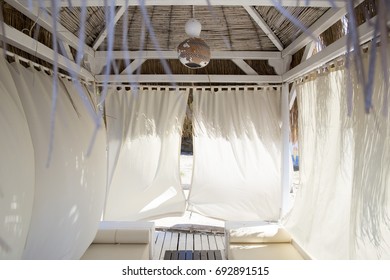 Cozy Interior Bungalow Interior In Pastel Colors With A Bamboo Roof And White Floor And Two Wooden Beach Trestle Beds