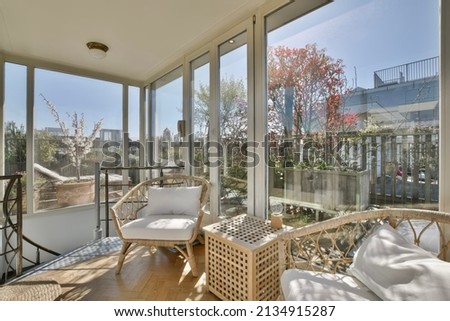 Cozy interior covered veranda with panoramic windows