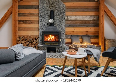 A cozy interior with a fireplace, couch, and coffee table