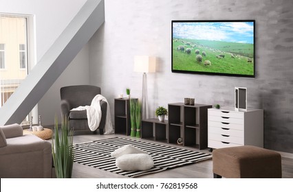 Cozy Interior Of Living Room With TV On Wall
