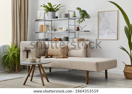 Cozy interior with stylish sofa, design coffee table, bookcase, plants, carpet, decoration, mock up poster map and elegant personal accessories. Neutral living room in classic house. Template.