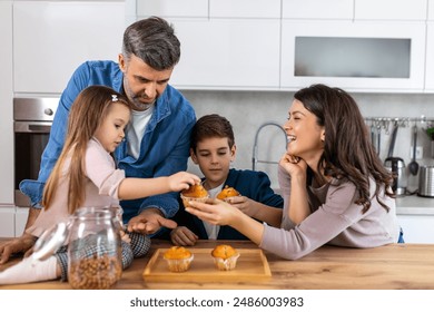 In the cozy kitchen, a family gathers around the table. With smiles on their faces enjoying the simple pleasures of togetherness and sweetness in every bite. - Powered by Shutterstock