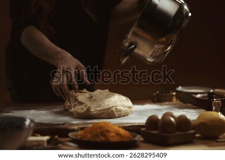 In a cozy kitchen filled with rustic charm, a child's hands knead soft dough covered with flour, symbolizing the joy of learning and the memories made through baking cherished family recipes