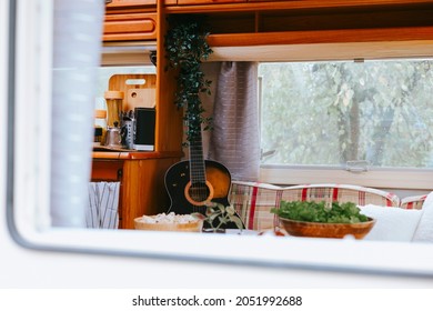 cozy kitchen interior in the trailer of mobile home or recreational vehicle, concept of family local travel in native country on caravan or camper van and camping life