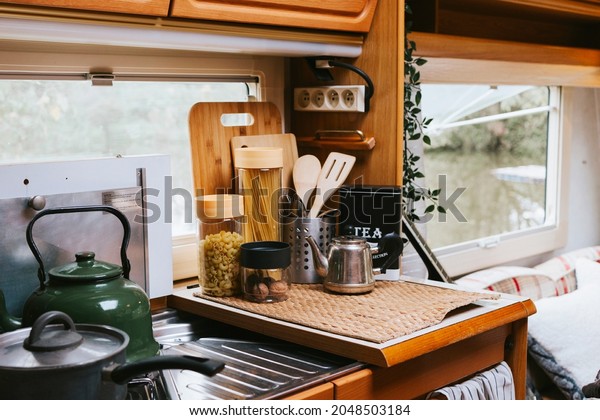 cozy kitchen\
interior in the trailer of mobile home or recreational vehicle,\
concept of family local travel in native country on caravan or\
camper van and camping\
life