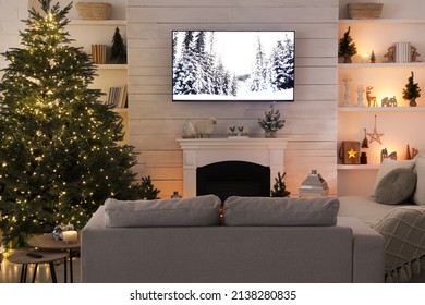 Cozy Living Room Interior With Beautiful Christmas Tree And Fireplace