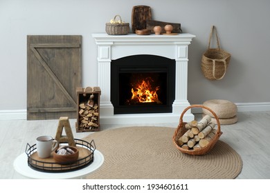 Cozy Living Room Interior With Firewood And White Fireplace