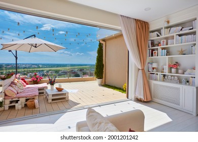 Cozy Living Room With Open Space Rooftop Patio, And Wooden Pallet Furniture Decorated With Colorful Pillows At Warm Summer Day