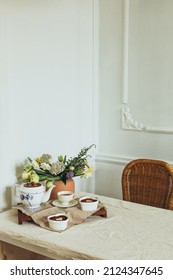 A Cozy Minimal Table Setting With Tablecloth, Vase With Flowers, Tea And Dessert Tiramisu With Heart