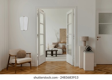 A cozy, minimalist living space with a mid-century modern armchair, soft lighting, and neutral tones. The room features glass doors, textured walls, and elegant decor, creating inviting atmosphere. - Powered by Shutterstock