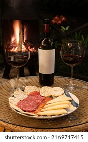 Cozy Night Around The Fire Place With Wine, Cheese And Jam