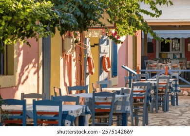 Cozy outdoor cafe in Fiskardo fishing village on Kefalonia island, Greece. Greek travel destination