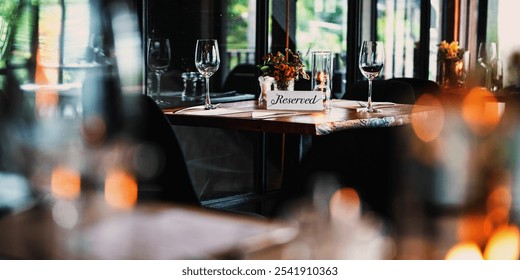 Cozy restaurant with a reserved table. Elegant tableware, reserved sign, and warm lighting create an inviting dining atmosphere. Table reserved at cozy and elegant restaurant. - Powered by Shutterstock