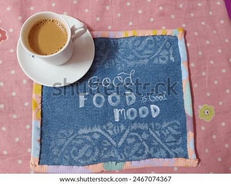 A cozy setup featuring a steaming cup of tea evoking a sense of comfort and positivity. The warm ambiance, soft lighting, and appetizing dishes create a perfect 