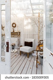 Cozy Shabby Chic Vibes In A Backyard Garden Studio, With Linen Chair, Faux Fireplace, Pumpkins, Diy Tree, And Fall Decor. 