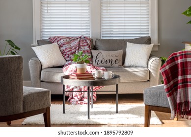 Cozy sitting room with a pillow that says "Let's stay home"