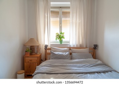 Cozy small bedroom in modern apartment