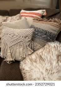 Cozy sofa corner with trendy textured boho toss pillows