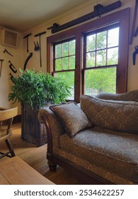 Cozy sofa next to window