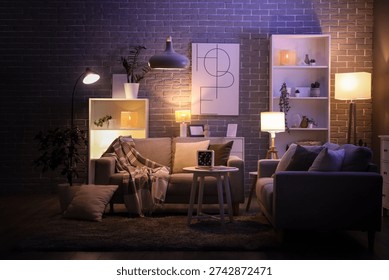 Cozy sofas and coffee table with alarm clock and magazine in interior of living room