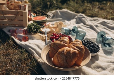 Cozy Spring Or Summer Picnic At Home. Romantic Picnic With Croissant, Fruits, Cheese And Drinks.