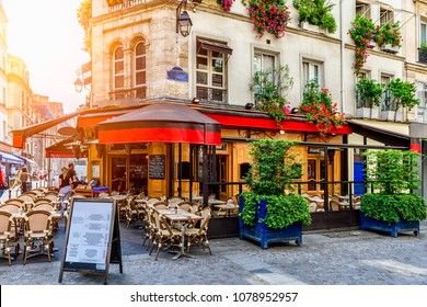 Cozy Street With Tables Of Cafe In Paris, France. Architecture And Landmark Of Paris. Cozy Paris Cityscape. 