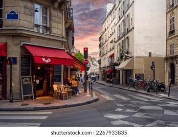 Cozy street with tables of cafe in Paris, France. Architecture and landmark of Paris. Cozy Paris cityscape