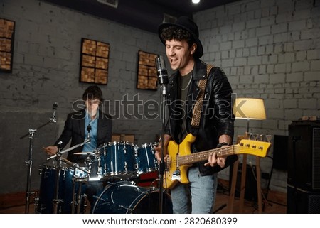 Cozy studio session capturing melodic riffs with talented band ensemble