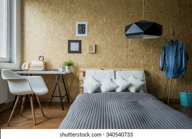 Cozy Teenage Bedroom With Trendy Wooden Wall