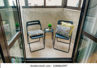 Cozy Terrace With Two Chairs And A Small Table