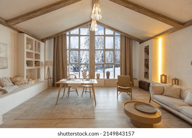 Cozy Warm Home Interior Of A Chic Country Chalet With A Huge Panoramic Window Overlooking The Winter Forest. Open Plan, Wood Decoration, Warm Colors And A Family Hearth