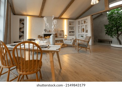 Cozy Warm Home Interior Of A Chic Country House With An Open Plan, Wood Finishes, Warm Colors And A Family Hearth. View Of The Dining Area, Table And Table Setting