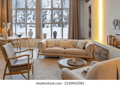 Cozy Warm Home Interior Of A Chic Country Chalet With A Huge Panoramic Window Overlooking The Winter Forest. Open Plan, Wood Decoration, Warm Colors And A Family Hearth