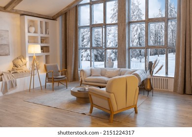 Cozy Warm Home Interior Of A Chic Country Chalet With A Huge Panoramic Window Overlooking The Winter Forest. Open Plan, Wood Decoration, Warm Colors And A Family Hearth