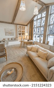 Cozy Warm Home Interior Of A Chic Country Chalet With A Huge Panoramic Window Overlooking The Winter Forest. Open Plan, Wood Decoration, Warm Colors And A Family Hearth