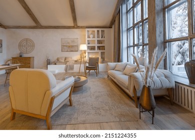 Cozy Warm Home Interior Of A Chic Country Chalet With A Huge Panoramic Window Overlooking The Winter Forest. Open Plan, Wood Decoration, Warm Colors And A Family Hearth