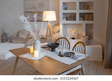 Cozy Warm Home Interior Of A Chic Country House With An Open Plan, Wood Finishes, Warm Colors And A Family Hearth. View Of The Dining Area, Table And Table Setting